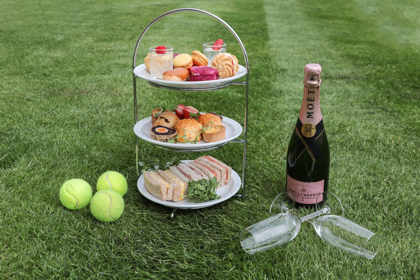 Afternoon Tea cake stand on the grass with tennis balls