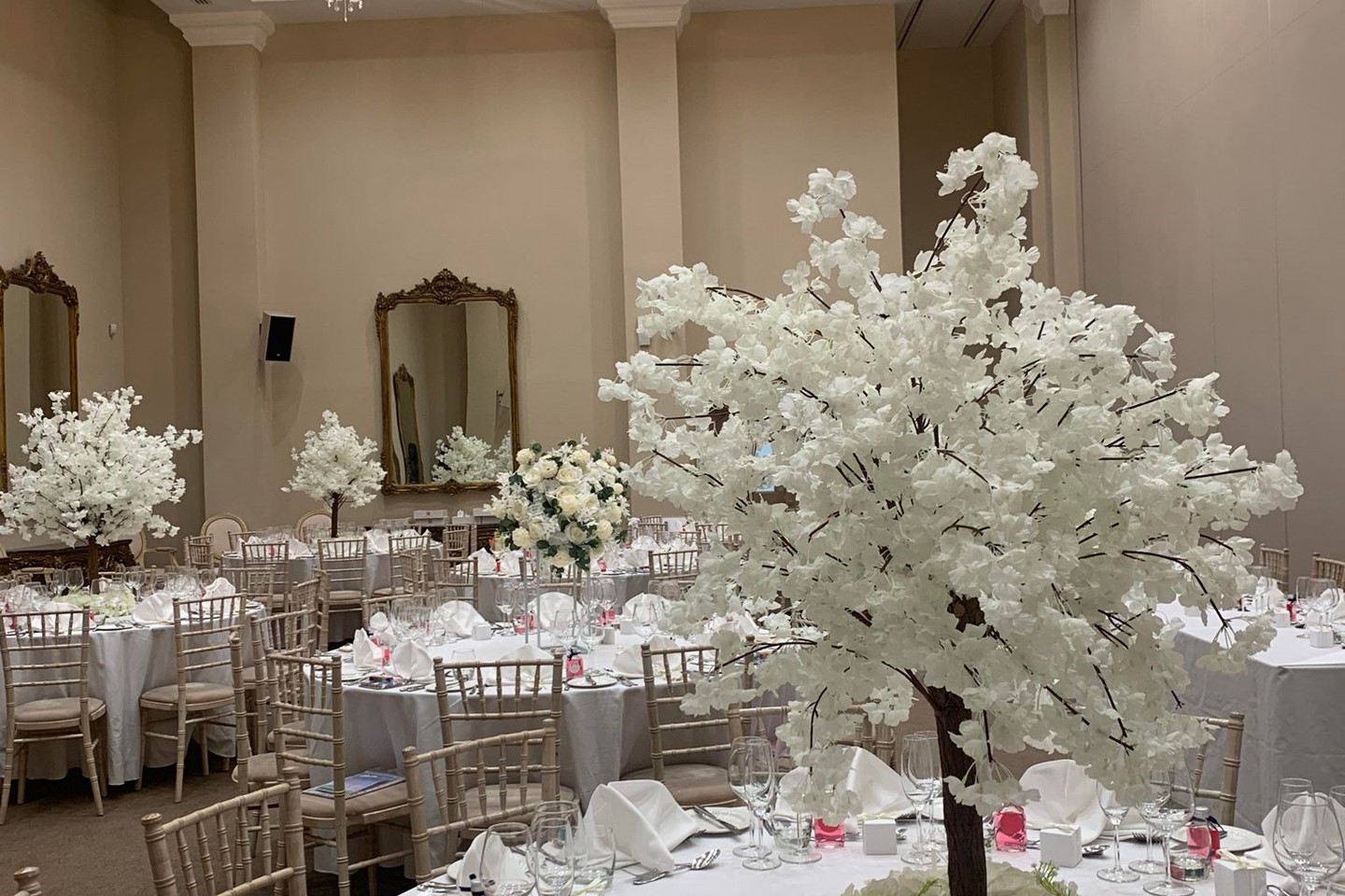 White tree table decor at a multicultural wedding